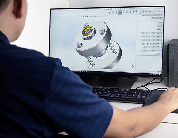 An engineer is designing a device of the aerosol filling machine with the CAD software